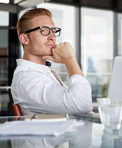 business man thinking at desk business man thinking at desk