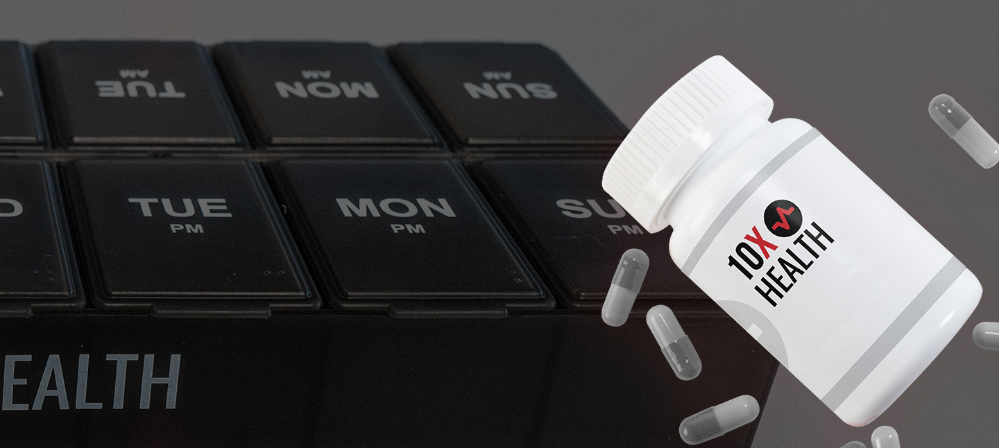 a bottle of 10X Health supplements laid over the 10X Health supplement organizer a bottle of 10X Health supplements laid over the 10X Health supplement organizer