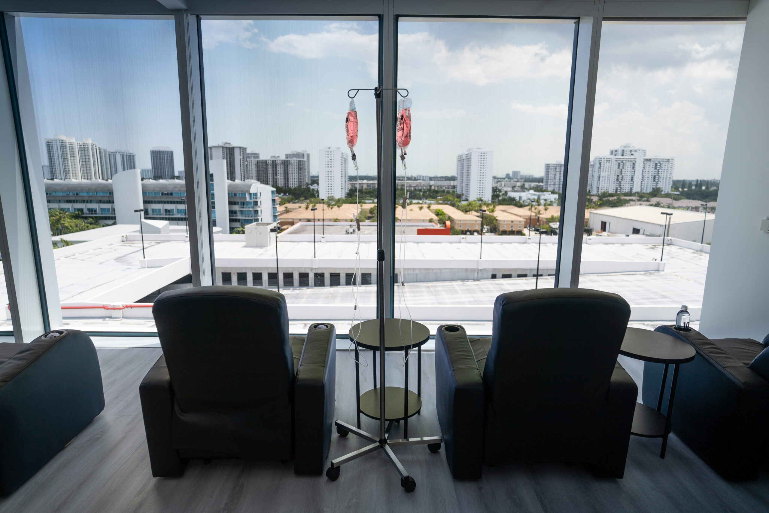 IV therapy stations in a 10X Health center with a view of the Miami skyline