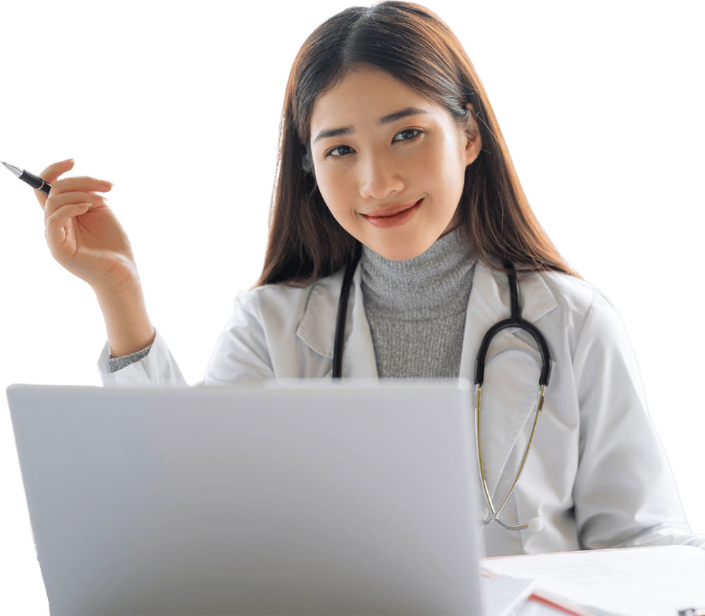a healthcare provider sitting at a laptop