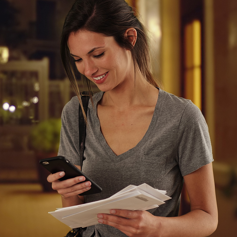 10X Health Blood Test Woman Checking Phone Holding Mail Square 800w 01